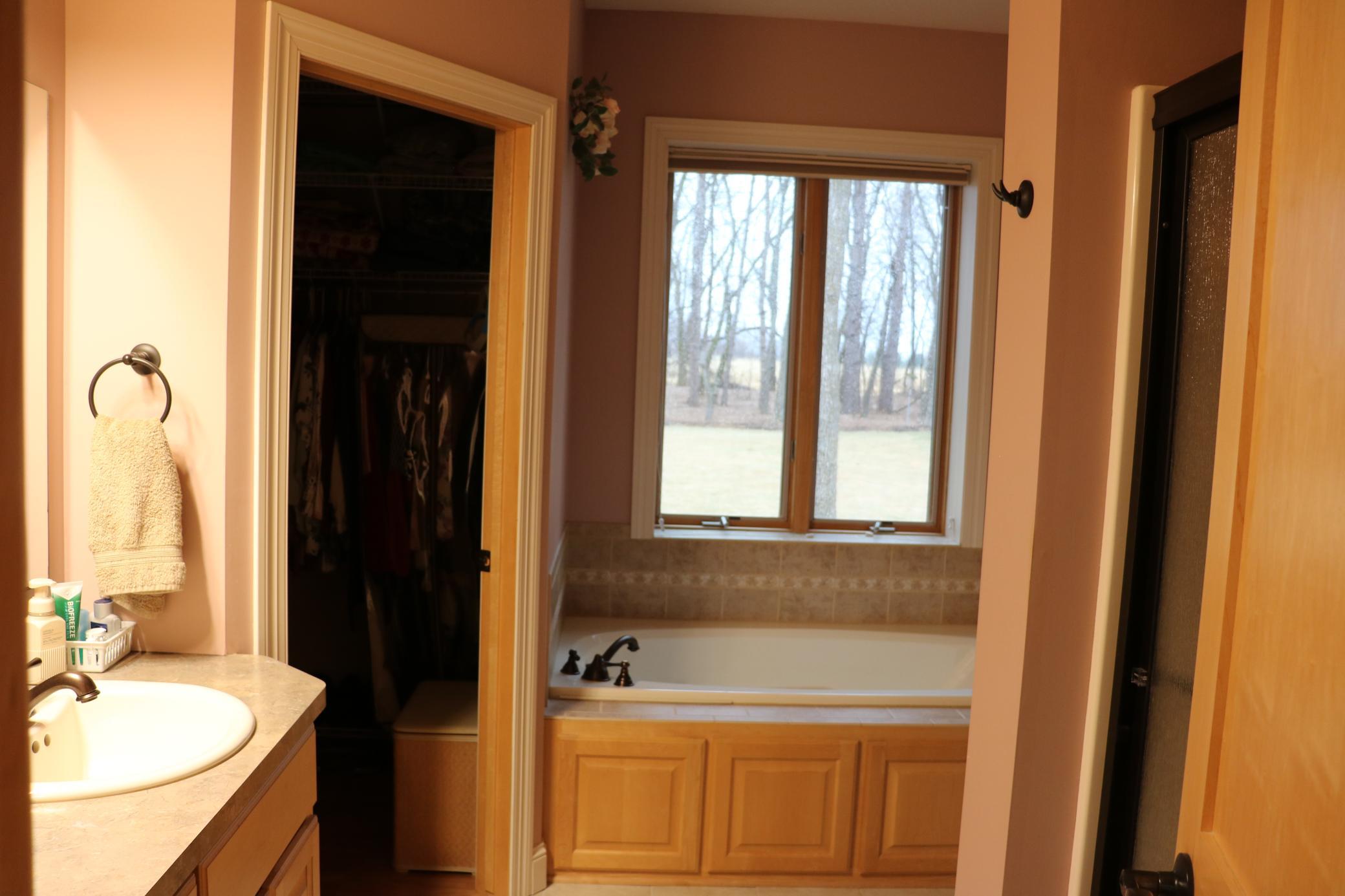 Primary bath offers a jetted tub