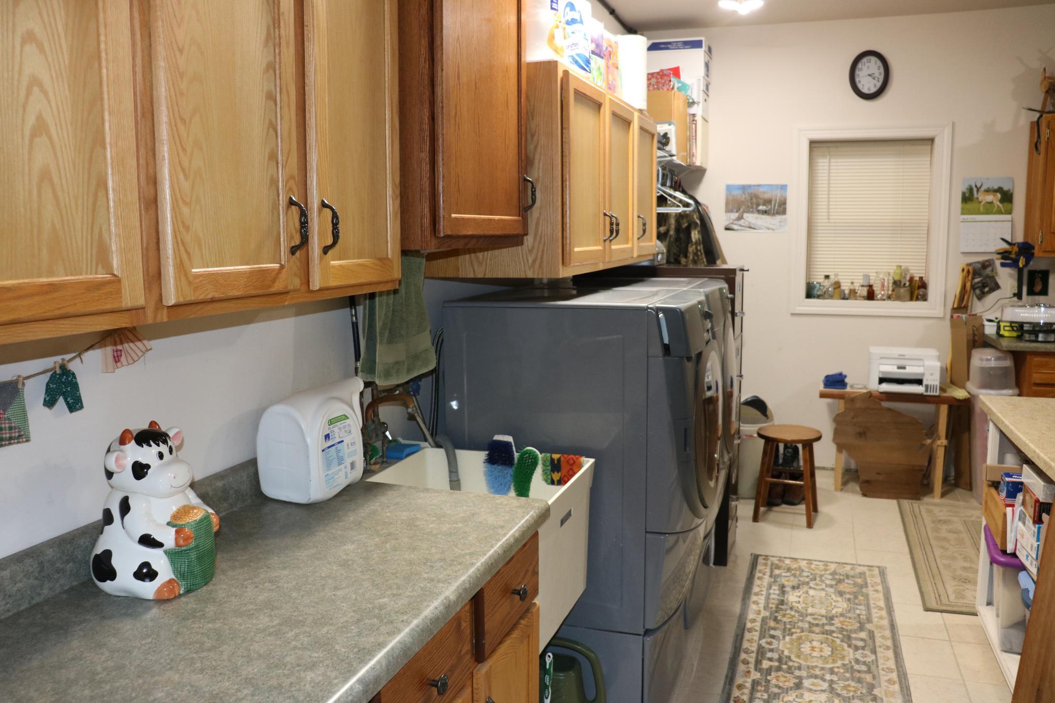 Laundry in utility room just off kitchen.