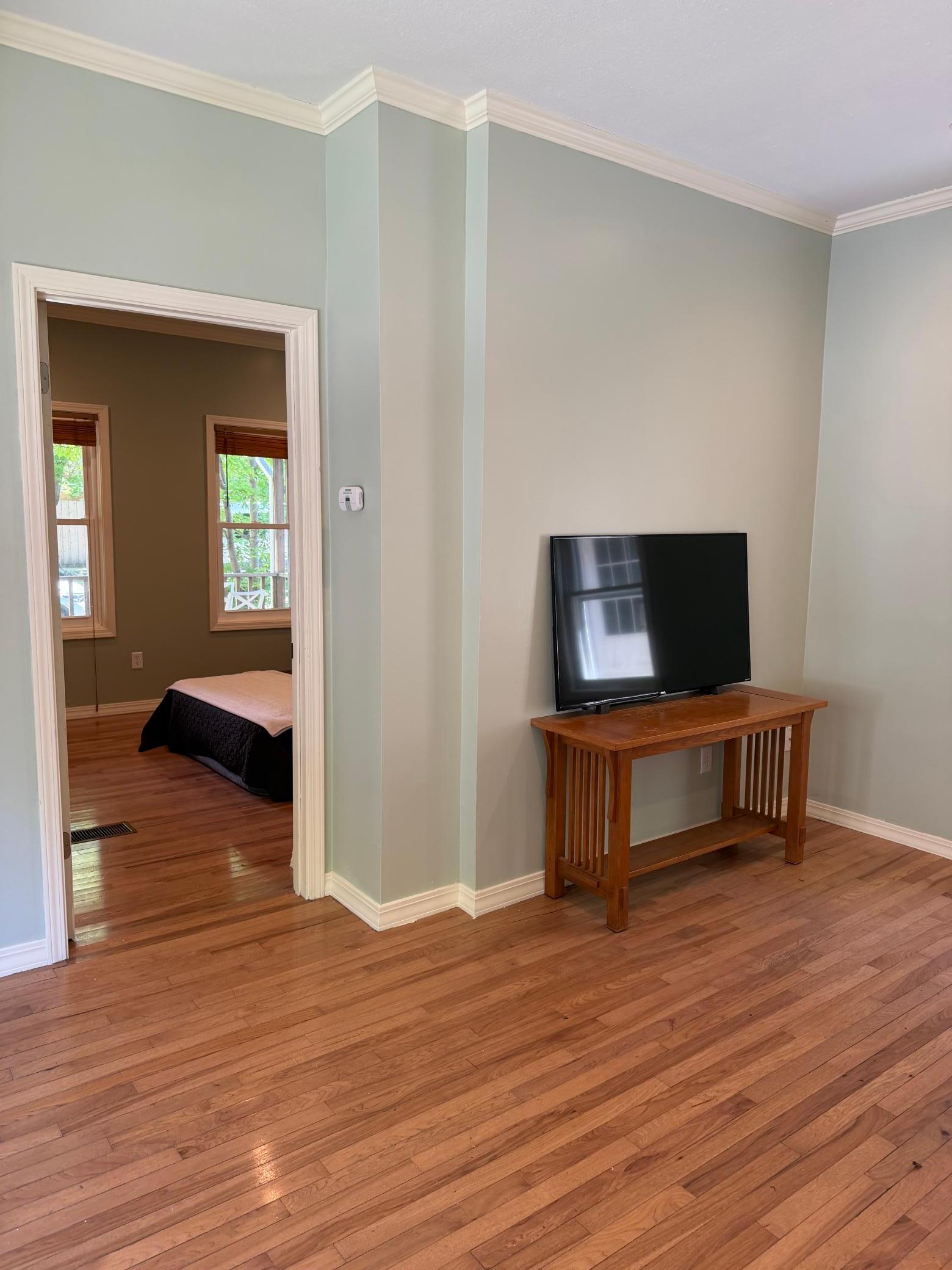 Living roomd goes in to the main floor bedroom
