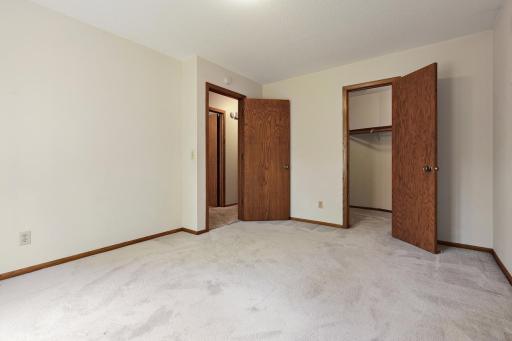 Another spacious bedroom with a walk in closet