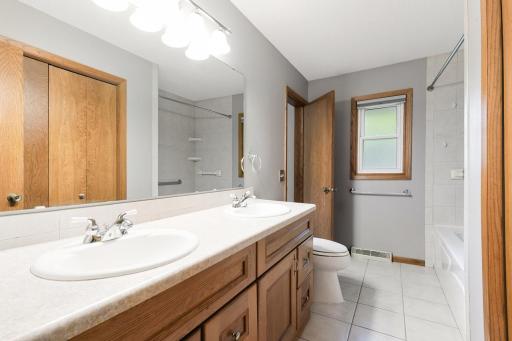 Full bathroom with double sinks and a jetted tub to relax and unwind