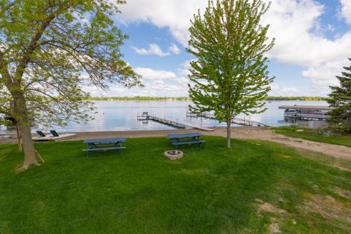 Rare deeded lake access with dock, picnic tables, beach and more!