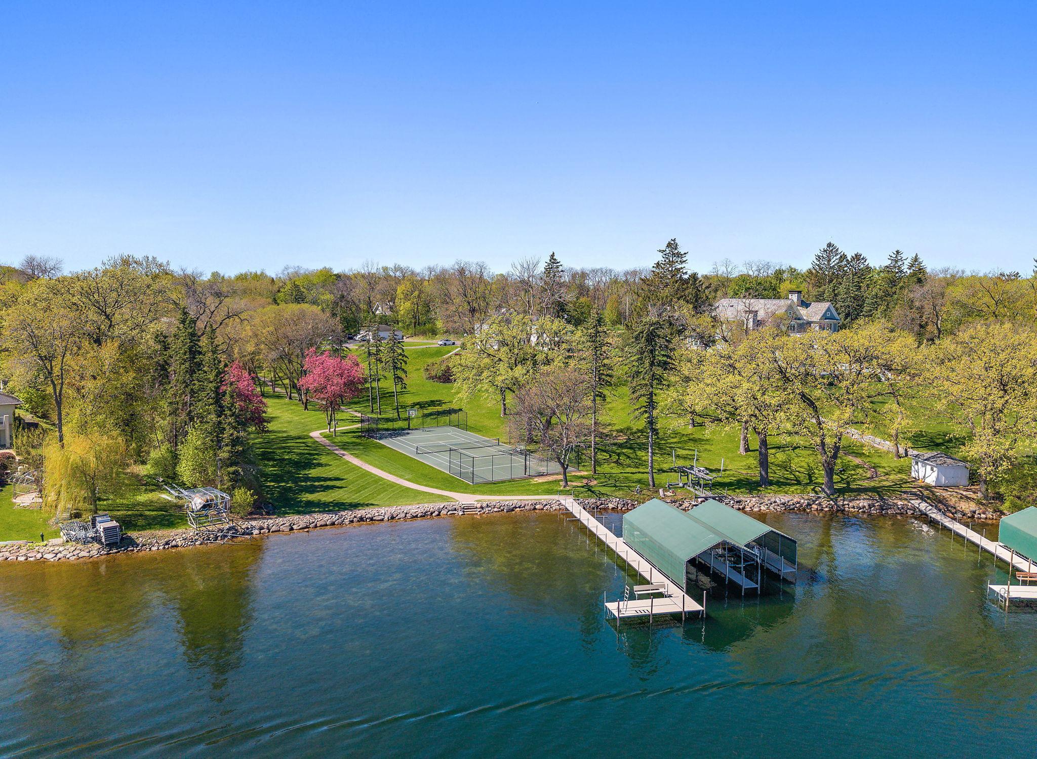 Ideal shore line, w/ Tennis court at waters edge