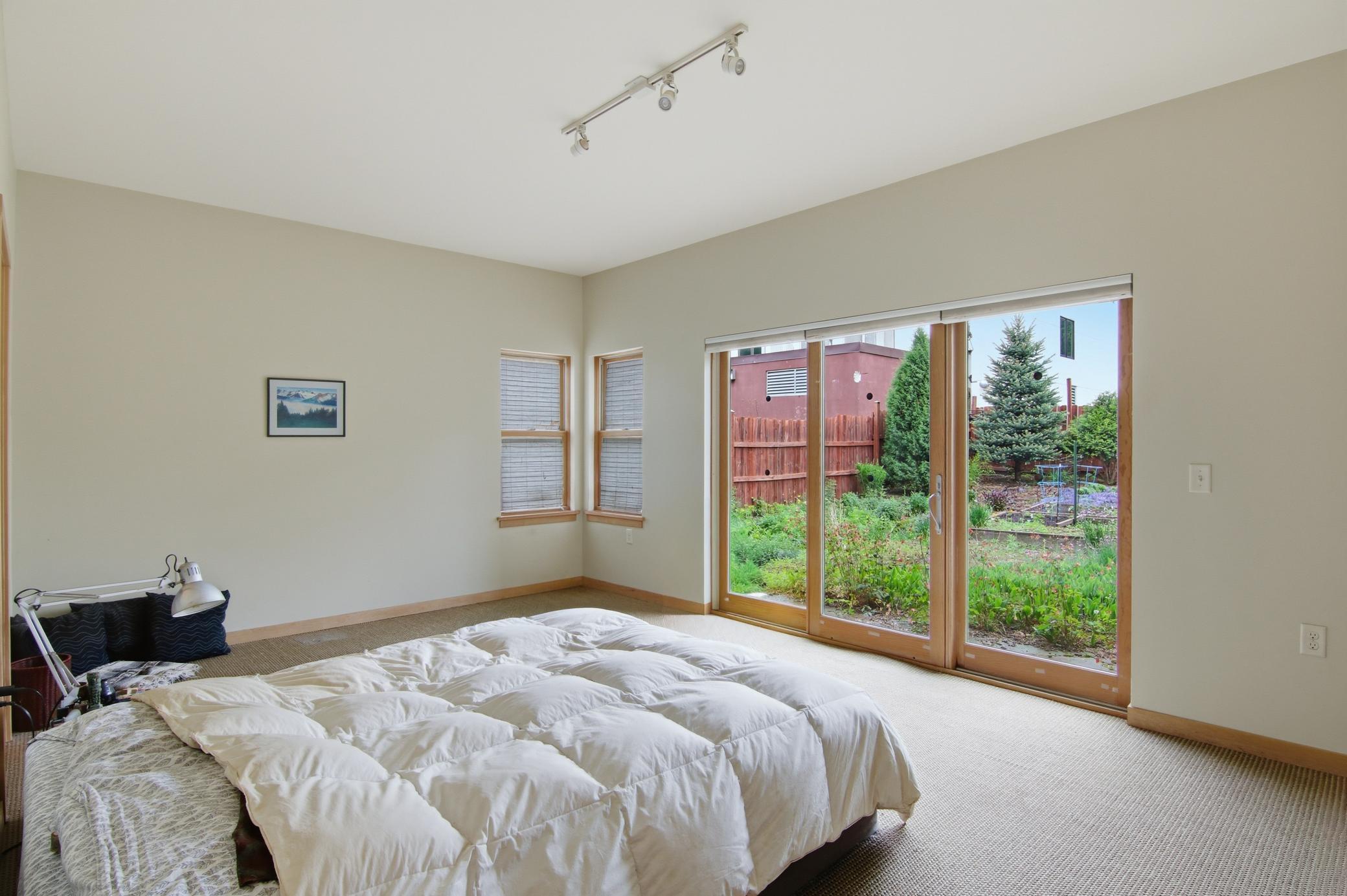 Primary bedroom with walkout to back patio.