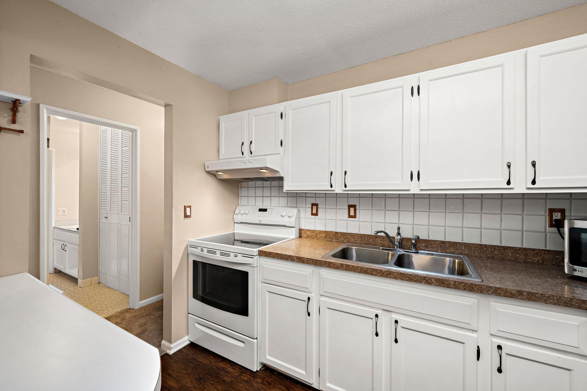 The kitchen has ample cupboard space.