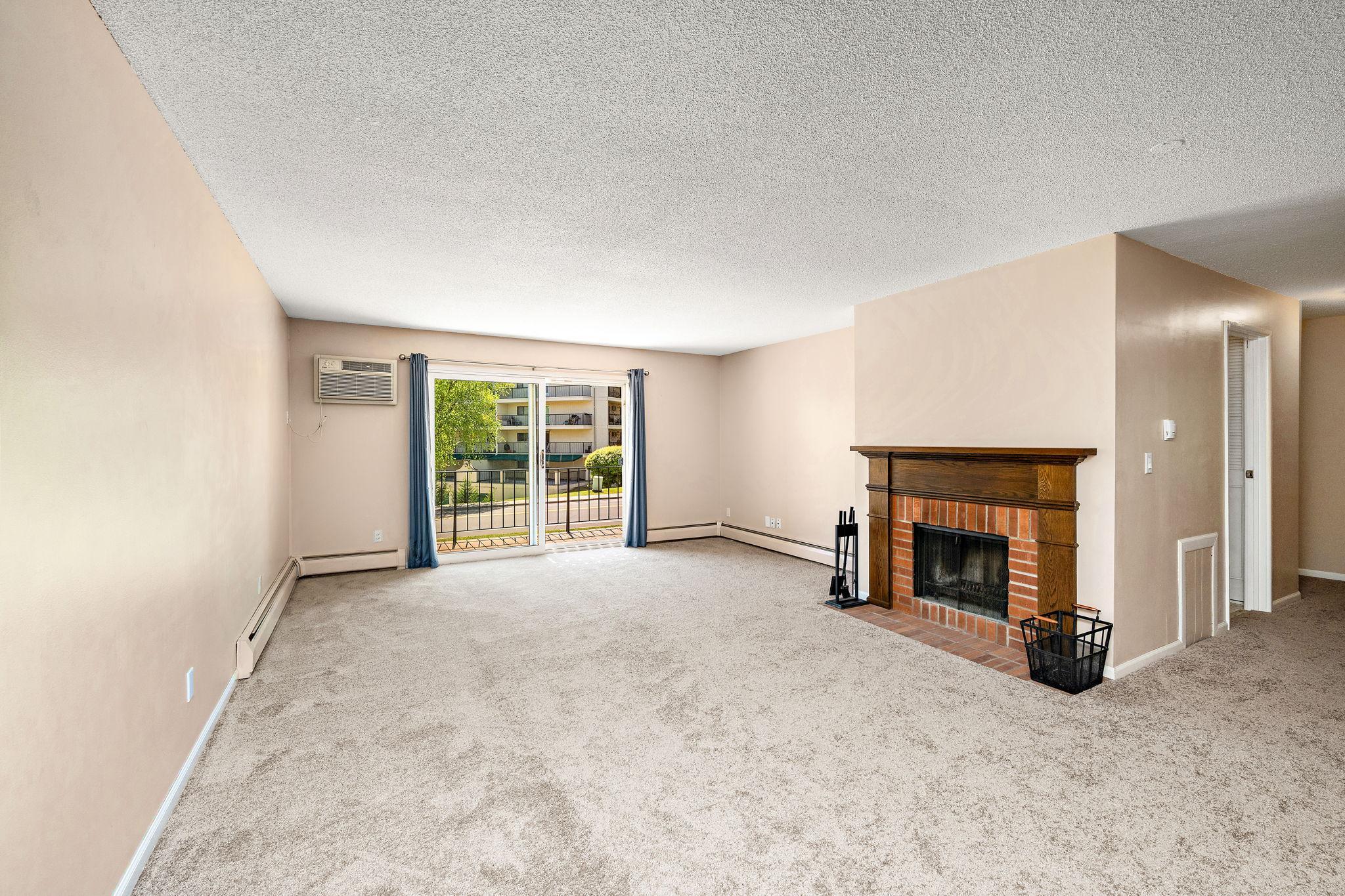 Living room with wood burning fireplace. The current seller has not used it.