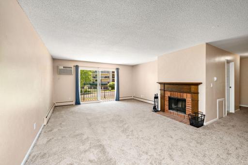 Living room with wood burning fireplace. The current seller has not used it.