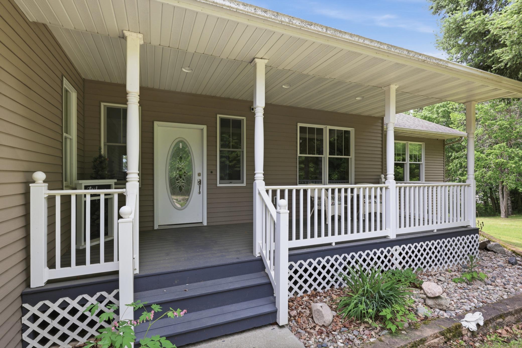 Covered Front Porch to Welcoming Foyer...
