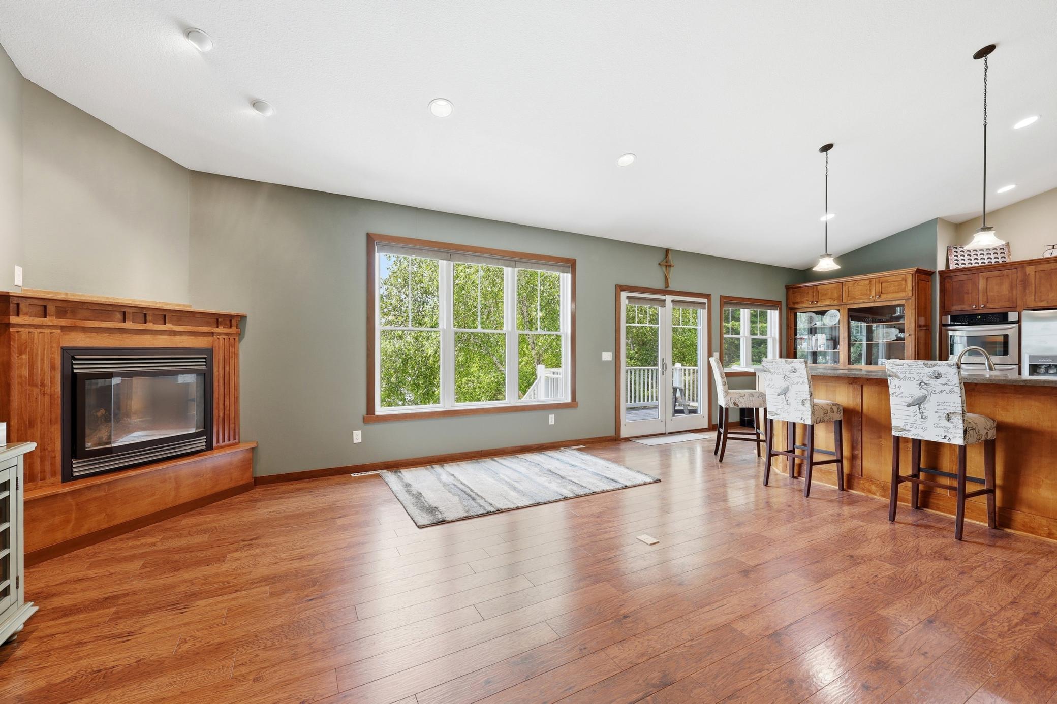 Upper Living room view to Kitchen & Lakefront Access to Deck