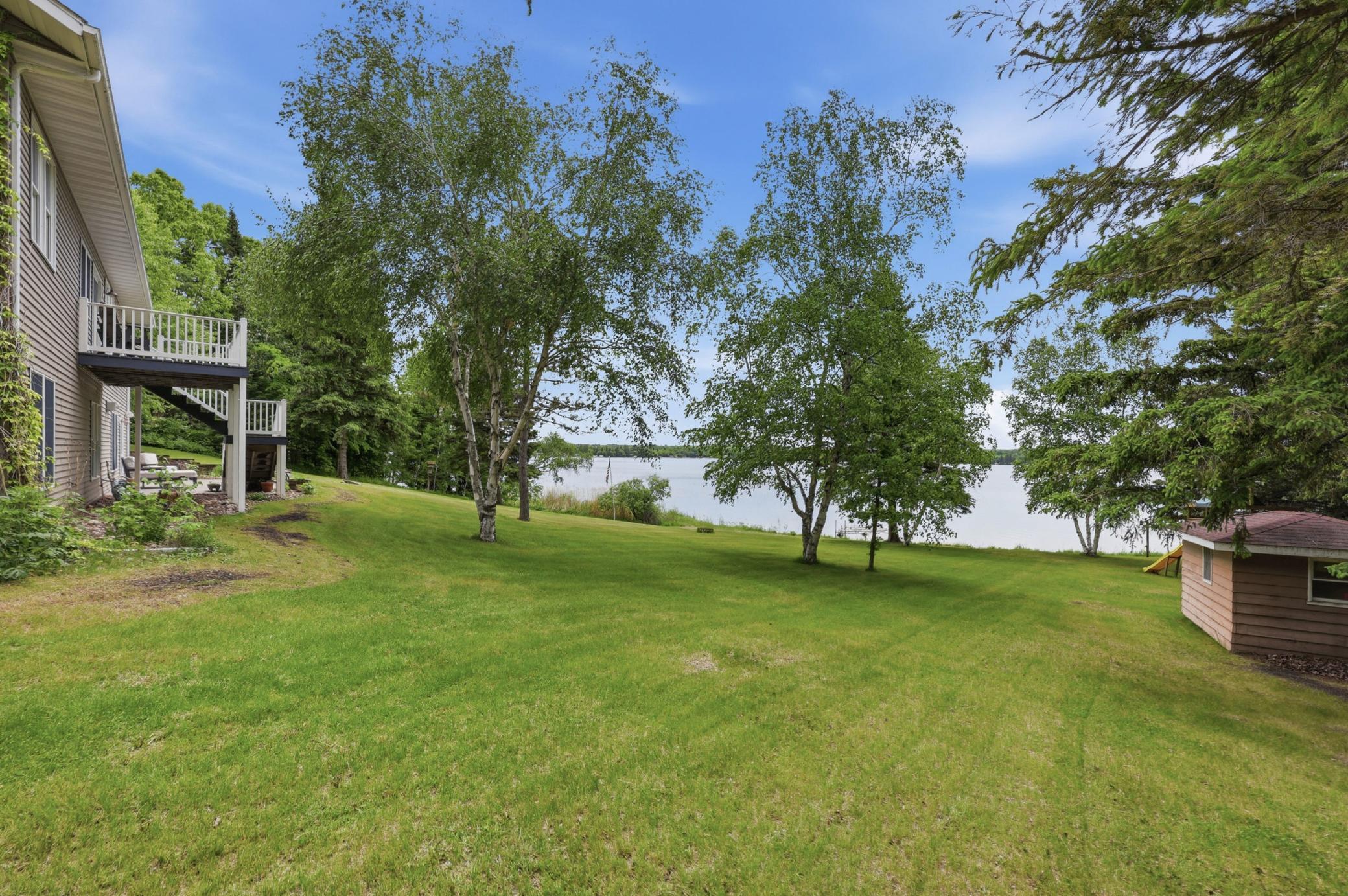 Gradual slope to lake from rear of home