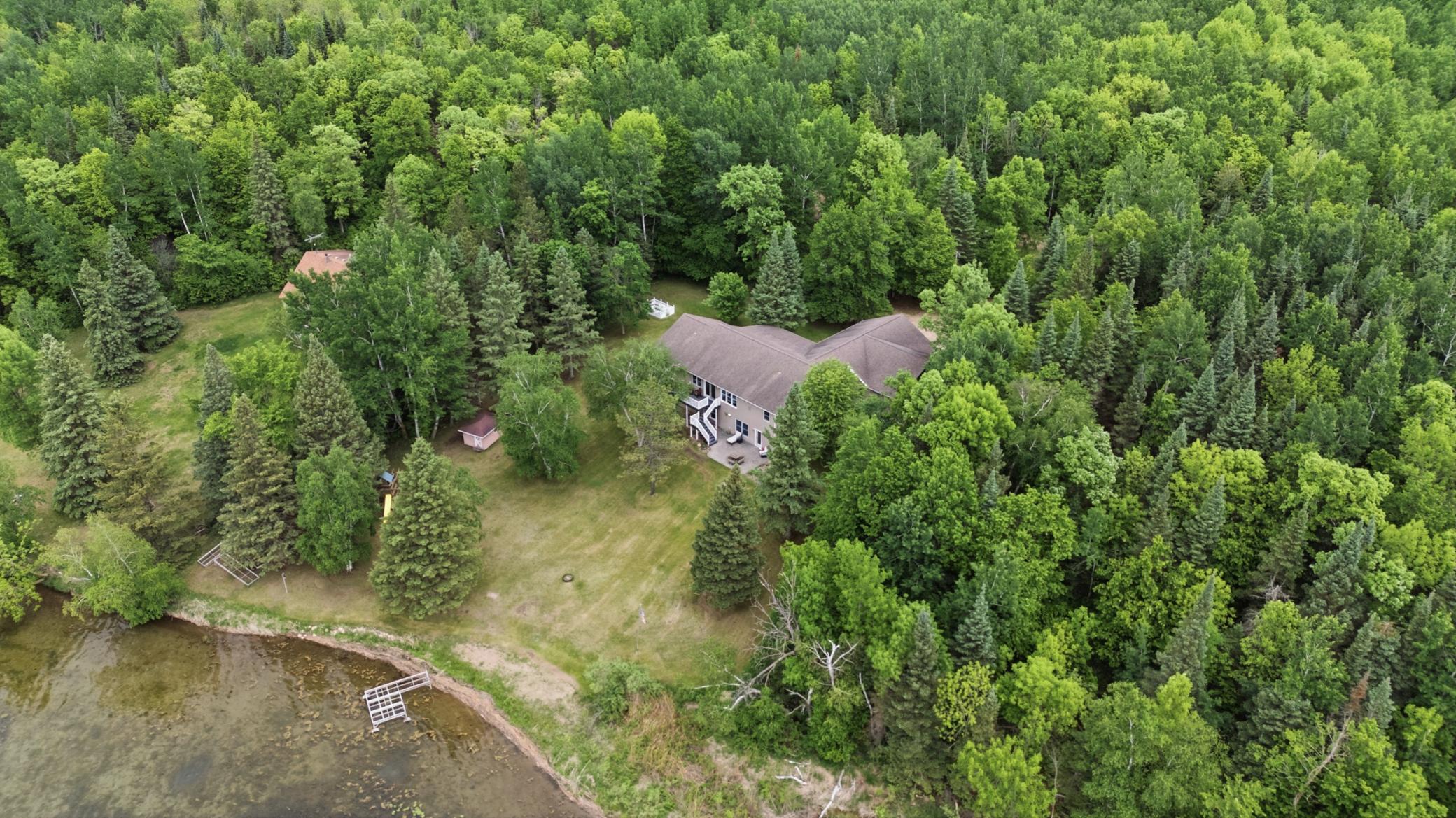 Large yard; gradual slope to lakefront; dock included