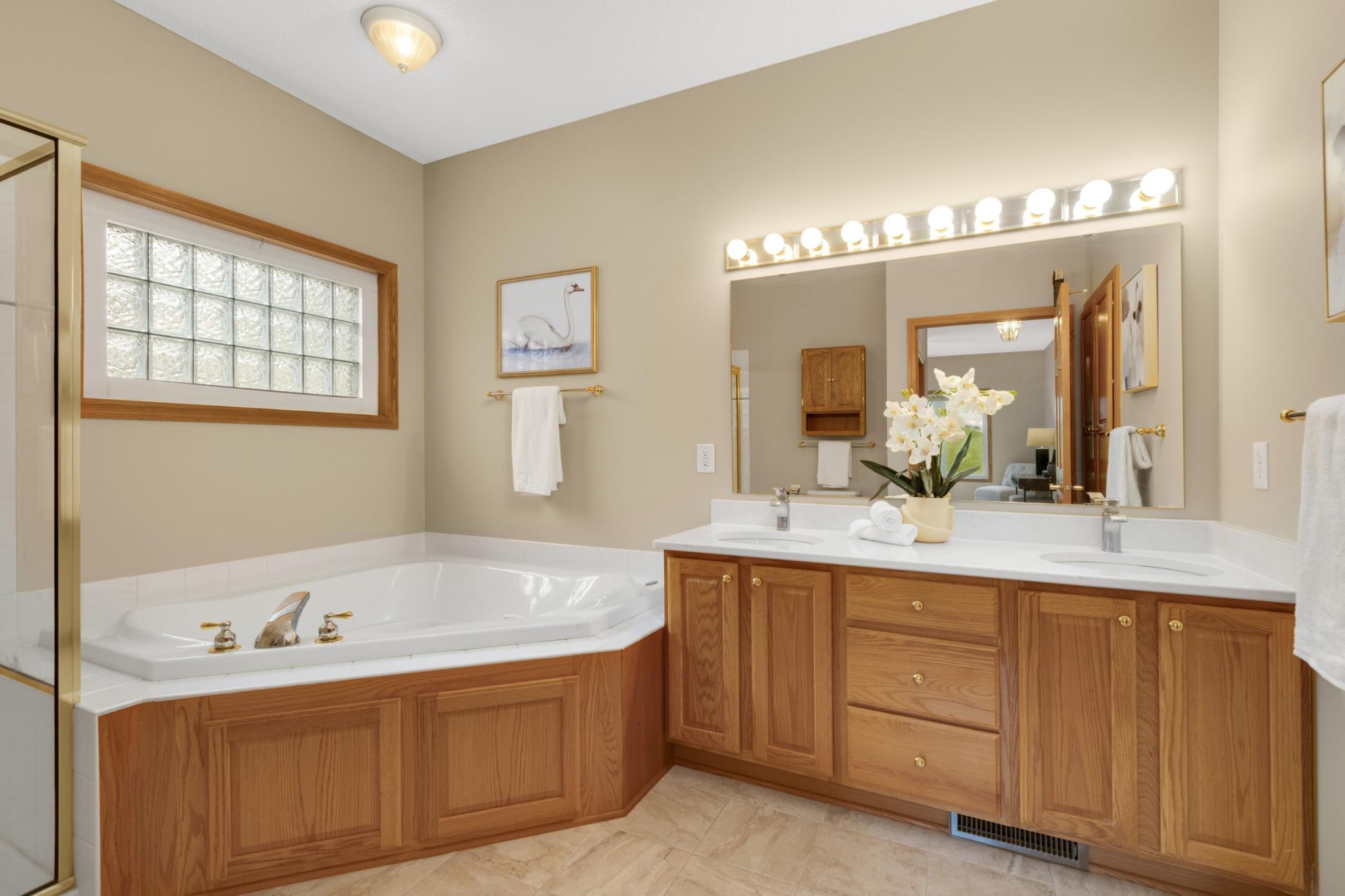 A relaxing primary bath with plenty of space and style