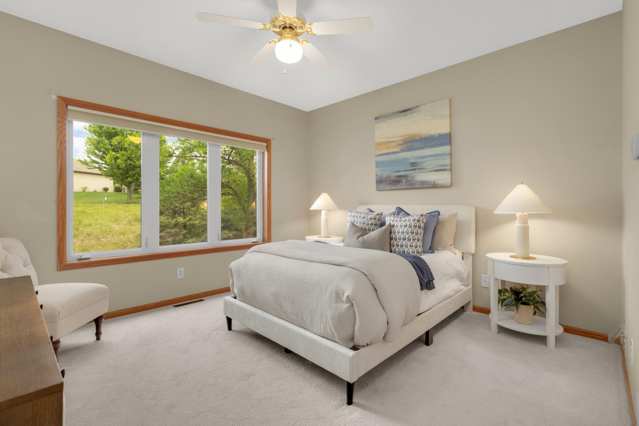 Spacious and serene, the primary bedroom offers the perfect private retreat