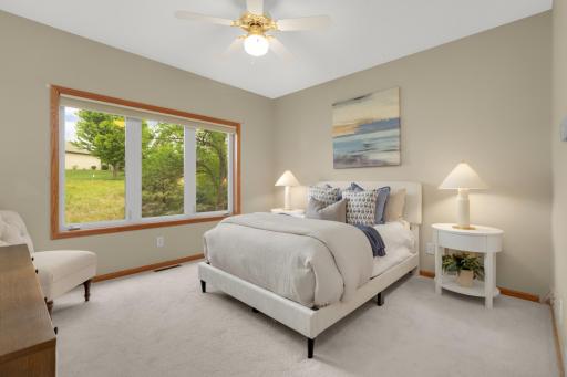 Spacious and serene, the primary bedroom offers the perfect private retreat