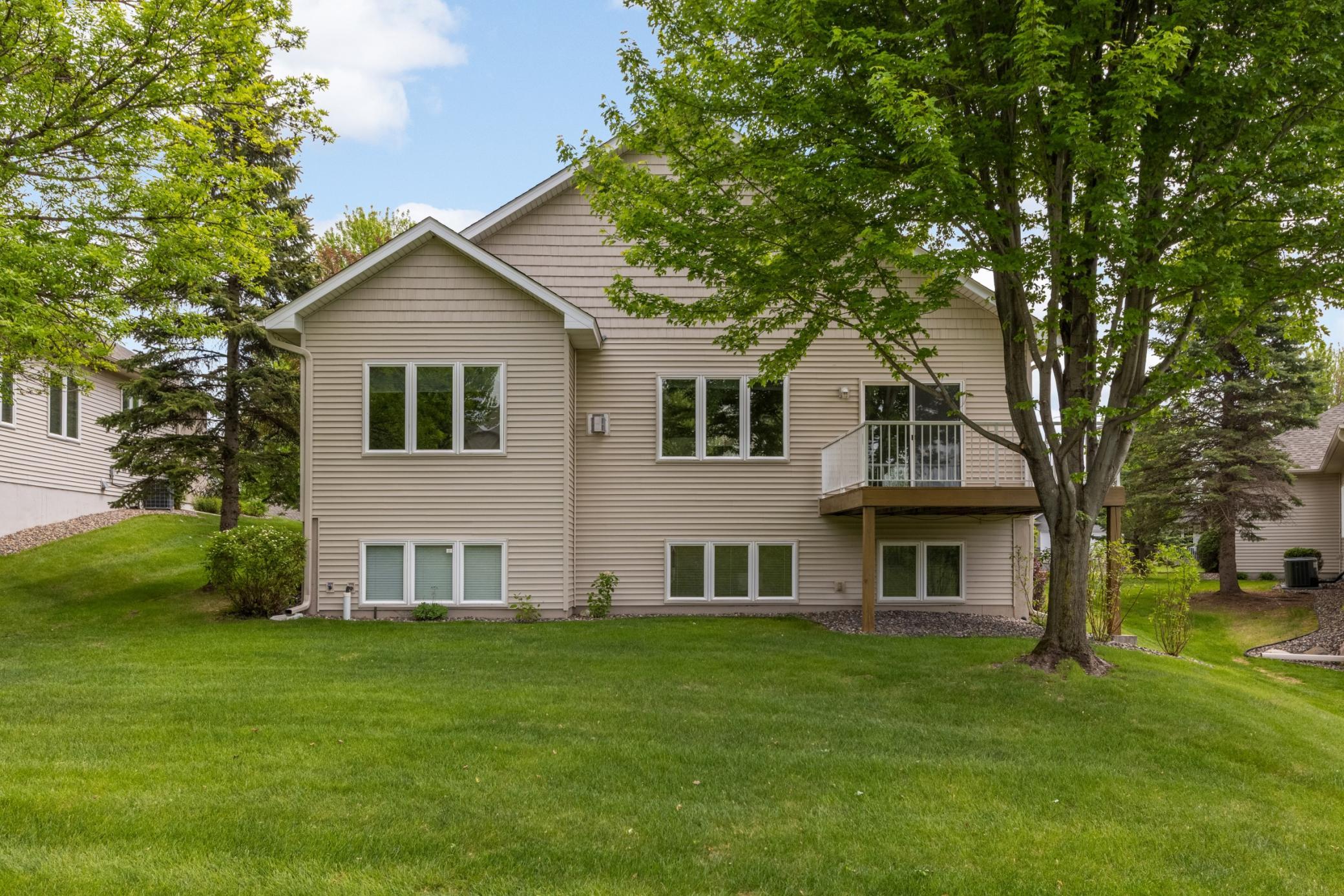 Step outside and enjoy the inviting backyard and well-kept exterior