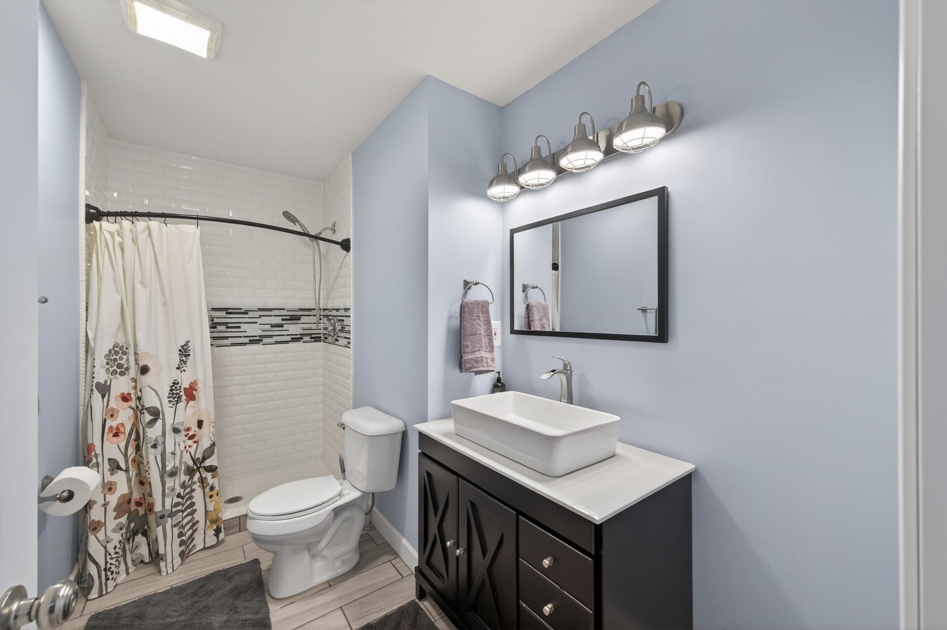 beautiful 3/4 tiled bath lower level.jpg
