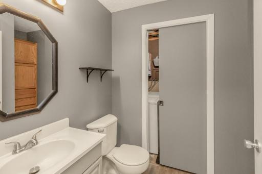 Clean and fresh lower level 3/4 bath with laundry room access.