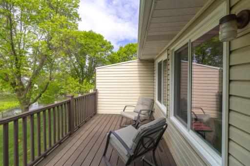 Maintenance free deck makes a tranquil spot overlooking the pond and greenspace.