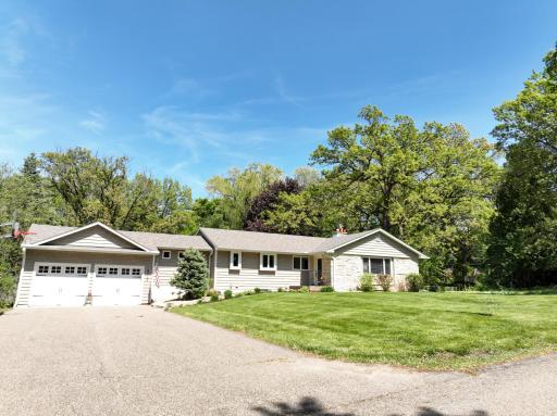 Updated & move-in ready! 4BR (2 main, 2 lower) & 3BA, including a private primary 3/4 ensuite. Walk-out lower level opens to a lush .5-acre wooded lot in Minnetonka Schools. The perfect blend of modern comfort & a serene, natural setting.