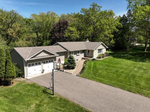 This isn't your average 4-bedroom home (2 main, 2 lower) layout and a private primary ensuite; it offers the perfect balance of privacy & connection. Step out from the lower-level walk-out directly into your own half-acre wooded sanctuary.