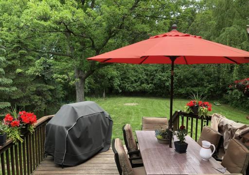 The perfect flow for entertaining! This main-level deck is steps from the kitchen and mudroom, making it easy to bring the party outdoors. Overlooking your private .5-acre wooded lot, itâs a serene spot for morning coffee or summer BBQs.