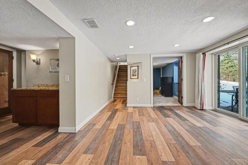 This photos shows the location of the 3rd bedroom and the entertaining bar counter with cabinets.