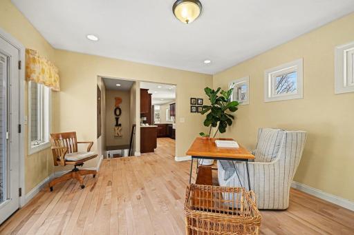 Endless possibilities! Viewed from the garage service door, this sun-filled room is ready for your unique needs. Perfect for a hobby space, secondary dining, or organized storage. Truly a multi-purpose gem off the kitchen.