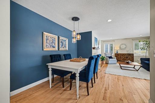 Dinner is served! Enjoy a formal dining space that opens directly to the living room. Let guests lounge by the fireplace while you prep in the kitchen just steps away. A bright, open floor plan designed for effortless entertaining.