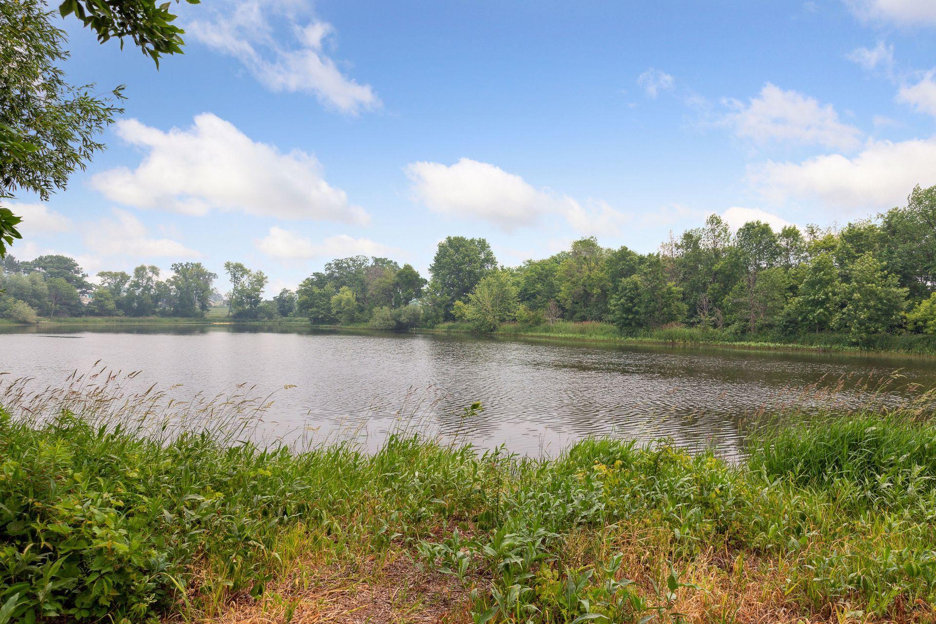 Privacy, nature, and room to breathe — this lot delivers all three. Set against a tranquil pond and wetlands with walking trails winding through the landscape, it's a setting as special as the home itself.