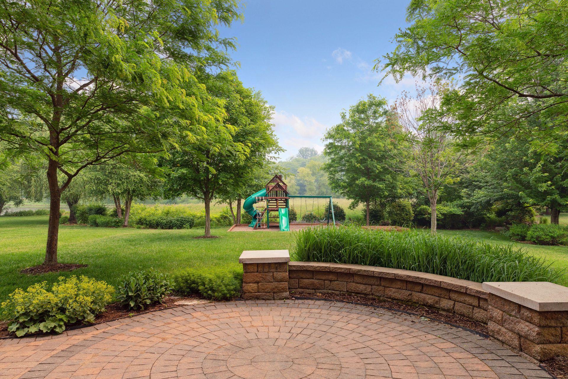 A beautifully designed custom paver patio — the ideal setting for outdoor living, dining, and taking in the peaceful private surroundings.