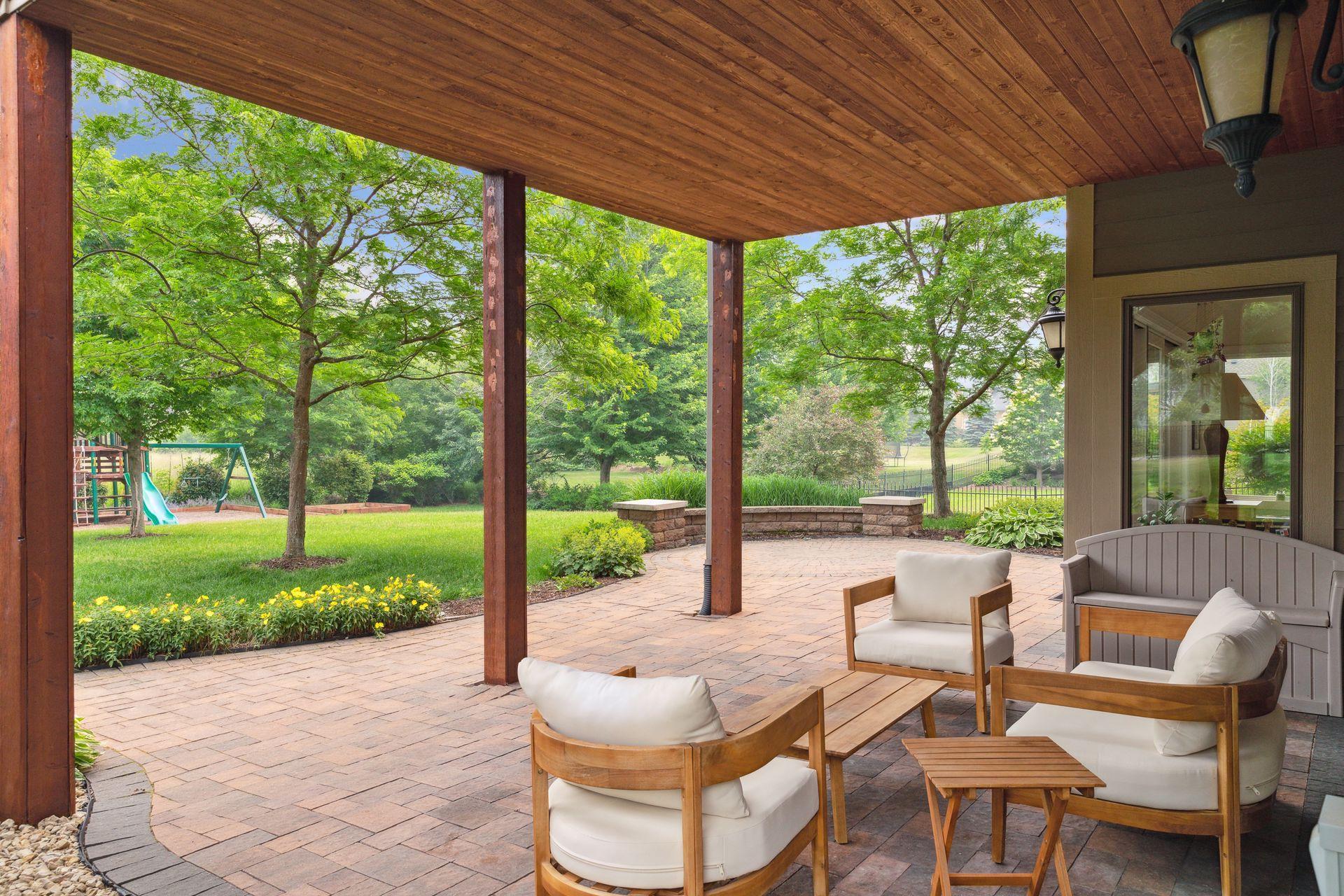 Outdoor living doesn't get much better than this — a covered patio with stunning backyard views that make every moment outside feel like a getaway.