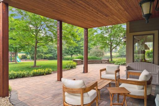 Outdoor living doesn't get much better than this â a covered patio with stunning backyard views that make every moment outside feel like a getaway.