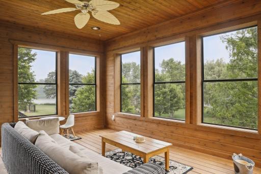 Cedar-wrapped and bathed in natural light, this stunning sunroom overlooks the backyard and flows seamlessly to the grill deck â complete with surround sound for the perfect indoor-outdoor experience.