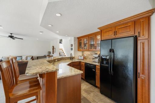 Fully equipped and beautifully appointed â granite countertops with bar seating, glass-front cabinetry, full fridge, dishwasher, microwave, and abundant storage. Hosting has never looked this good.