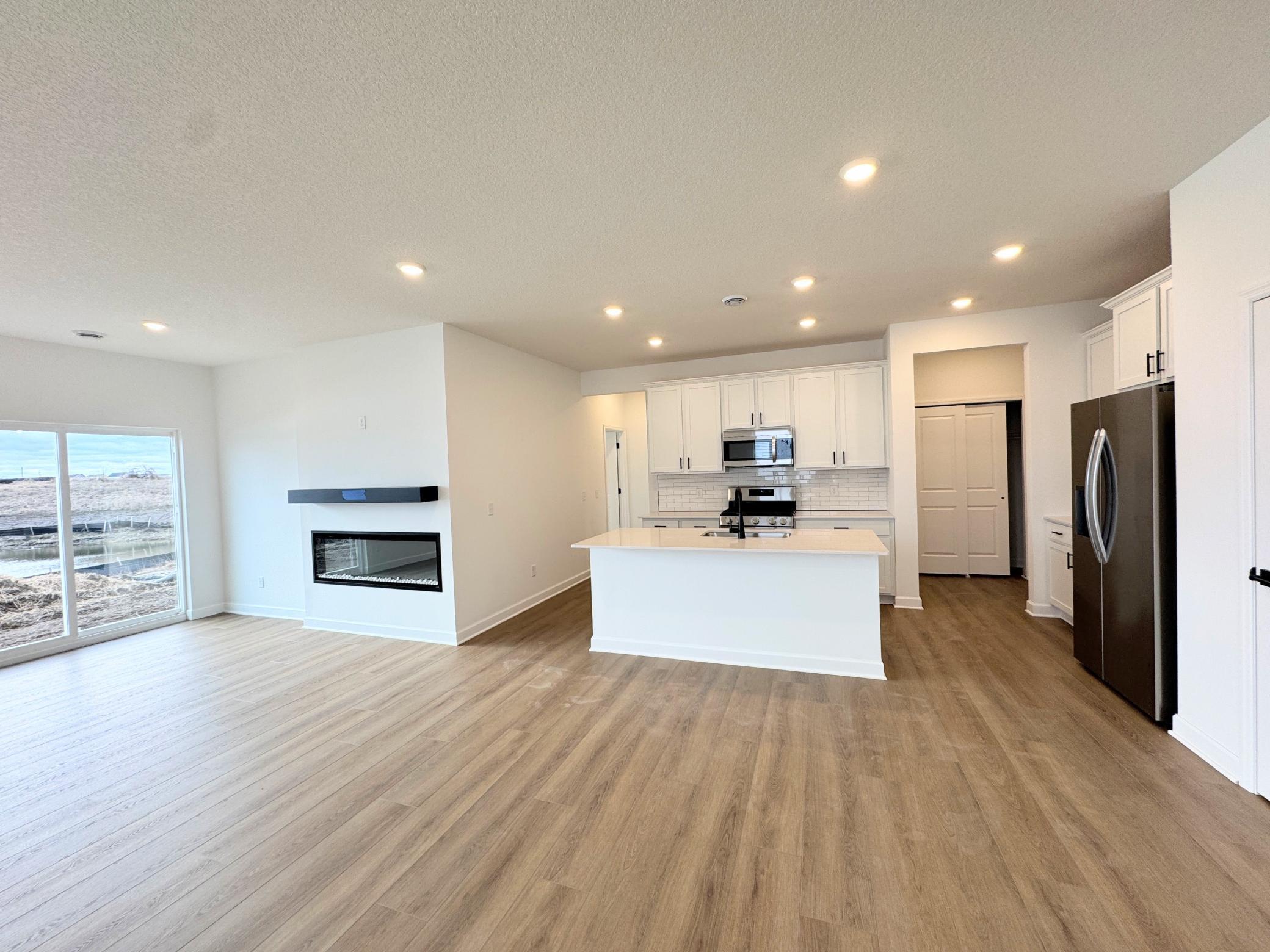 An open concept design allows the kitchen to flow seamlessly into the dining room, making multitasking simple