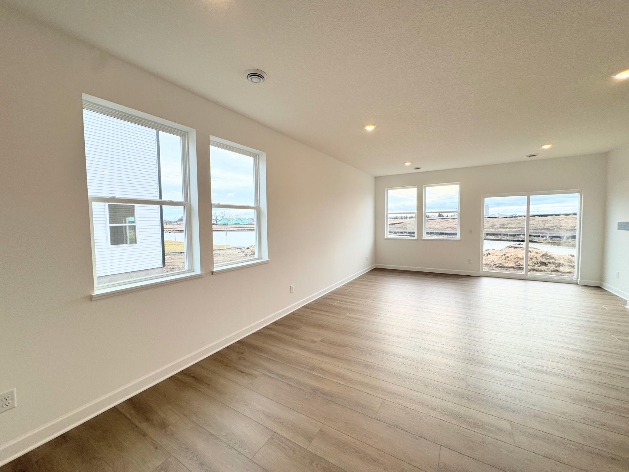 A sliding glass door offers convenient outdoor access and al fresco dining options