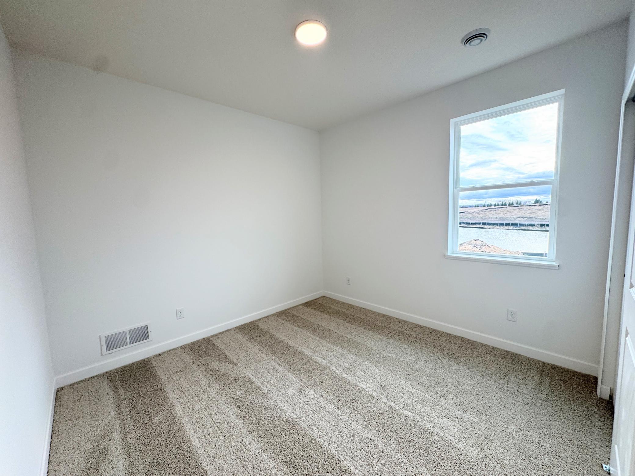 Three secondary bedrooms are found upstairs, just down the hall from the loft and owner’s suite.