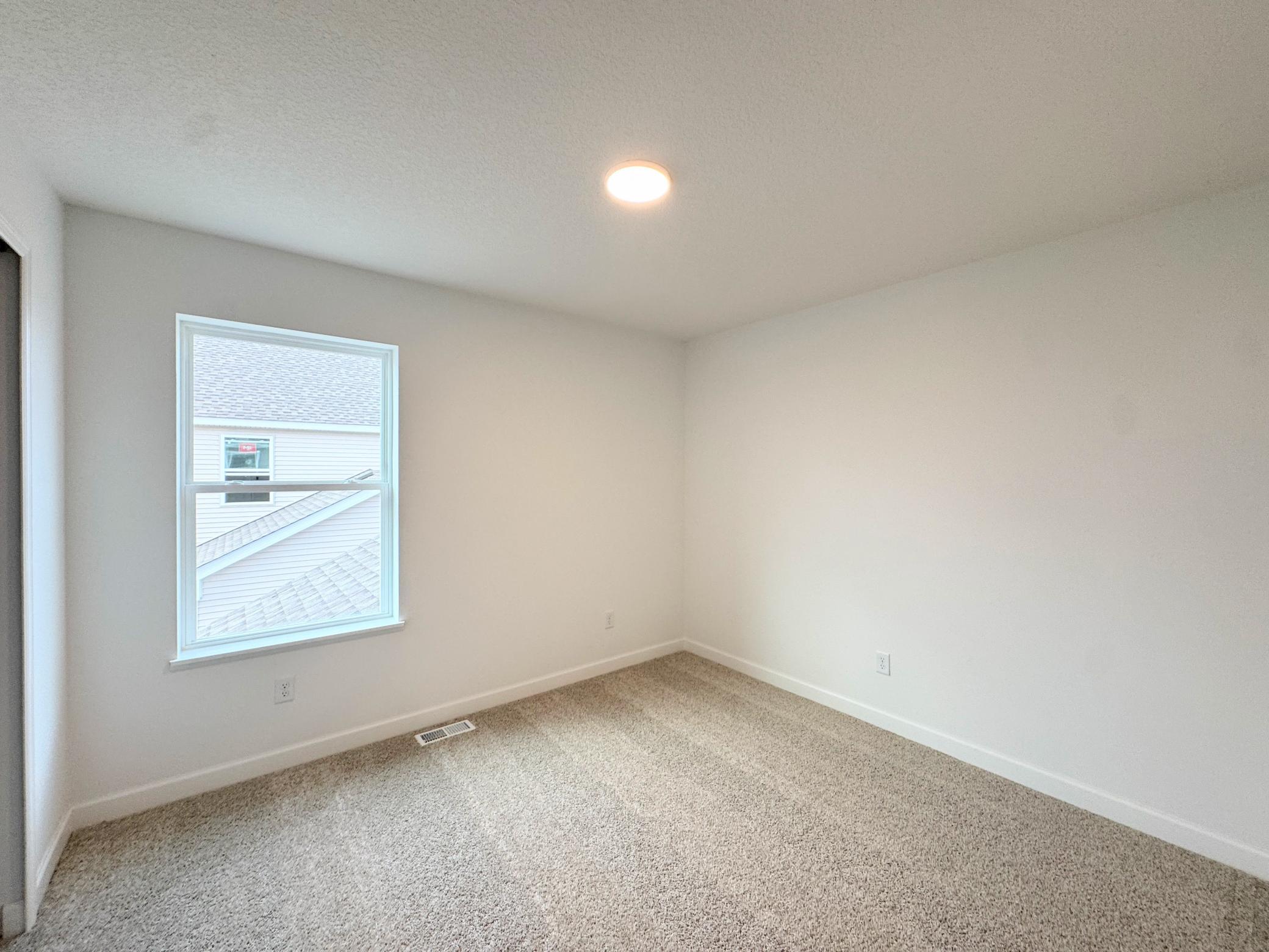The bedrooms are blank canvases ready for the resident’s personal style.