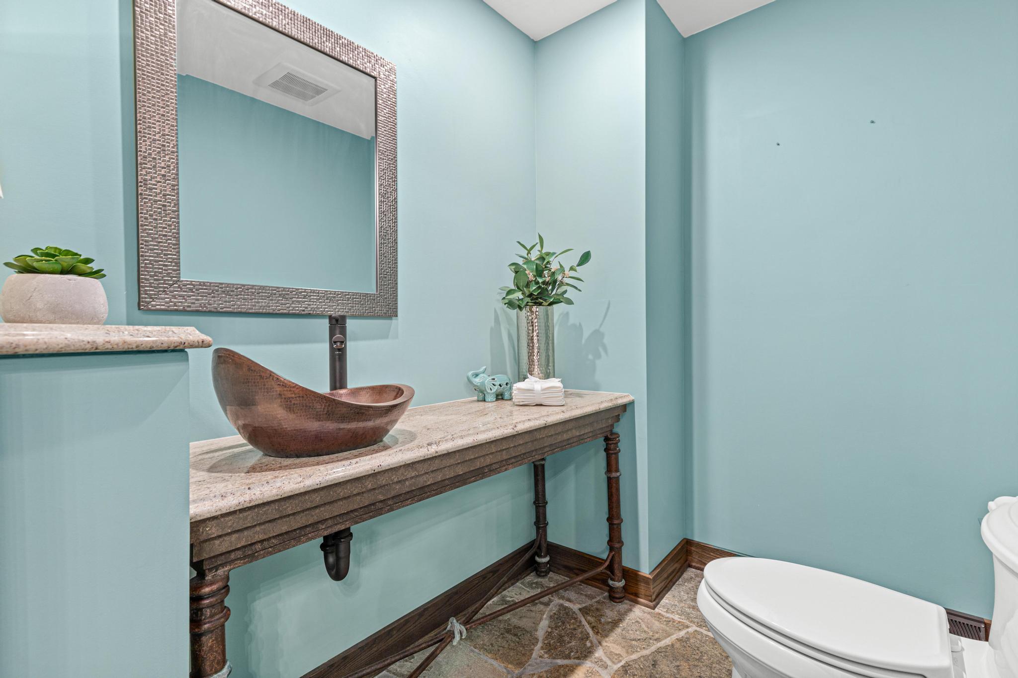 Main floor half bathroom, located near the foyer.