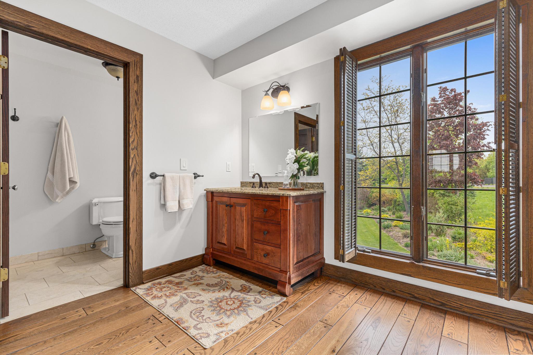 Oversized bathroom area is perfect for multiple people getting ready at one time. Large walk-in closet to the right.