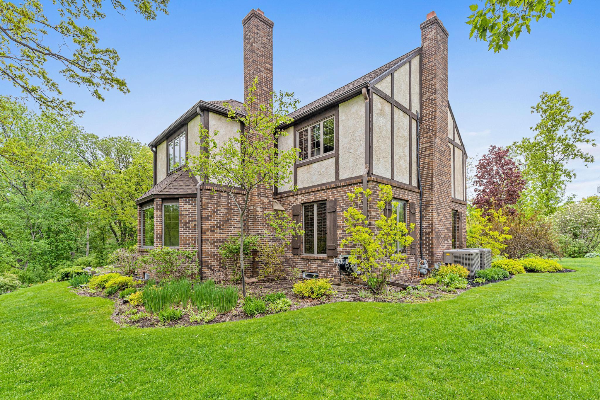 Stately, sophisticated, and truly one-of-a-kind, this extraordinary estate is nestled on over four picturesque rolling acres directly across from Dellwood Country Club.
