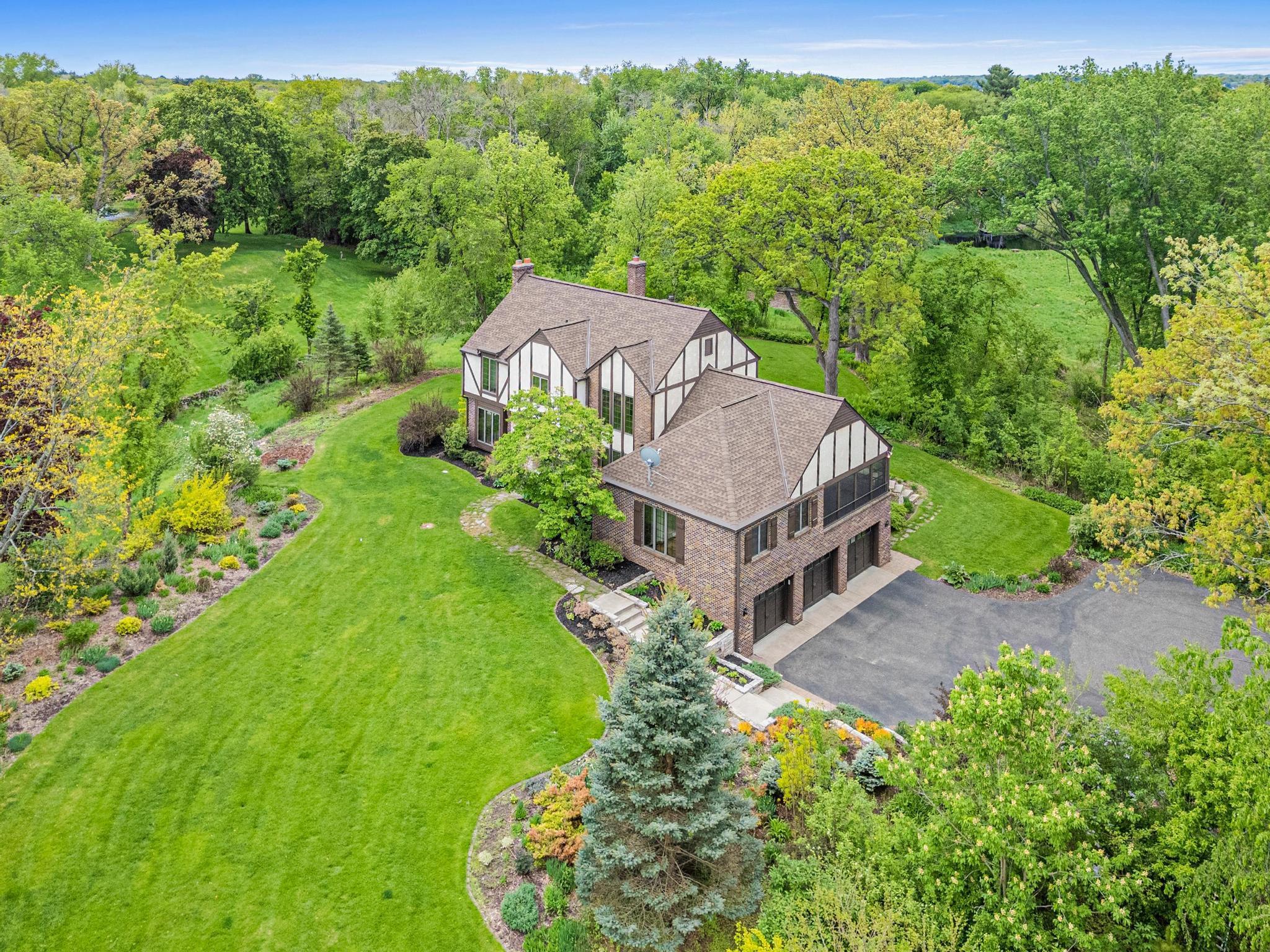 Grand estate setting on over four picturesque acres with breathtaking meadow views.