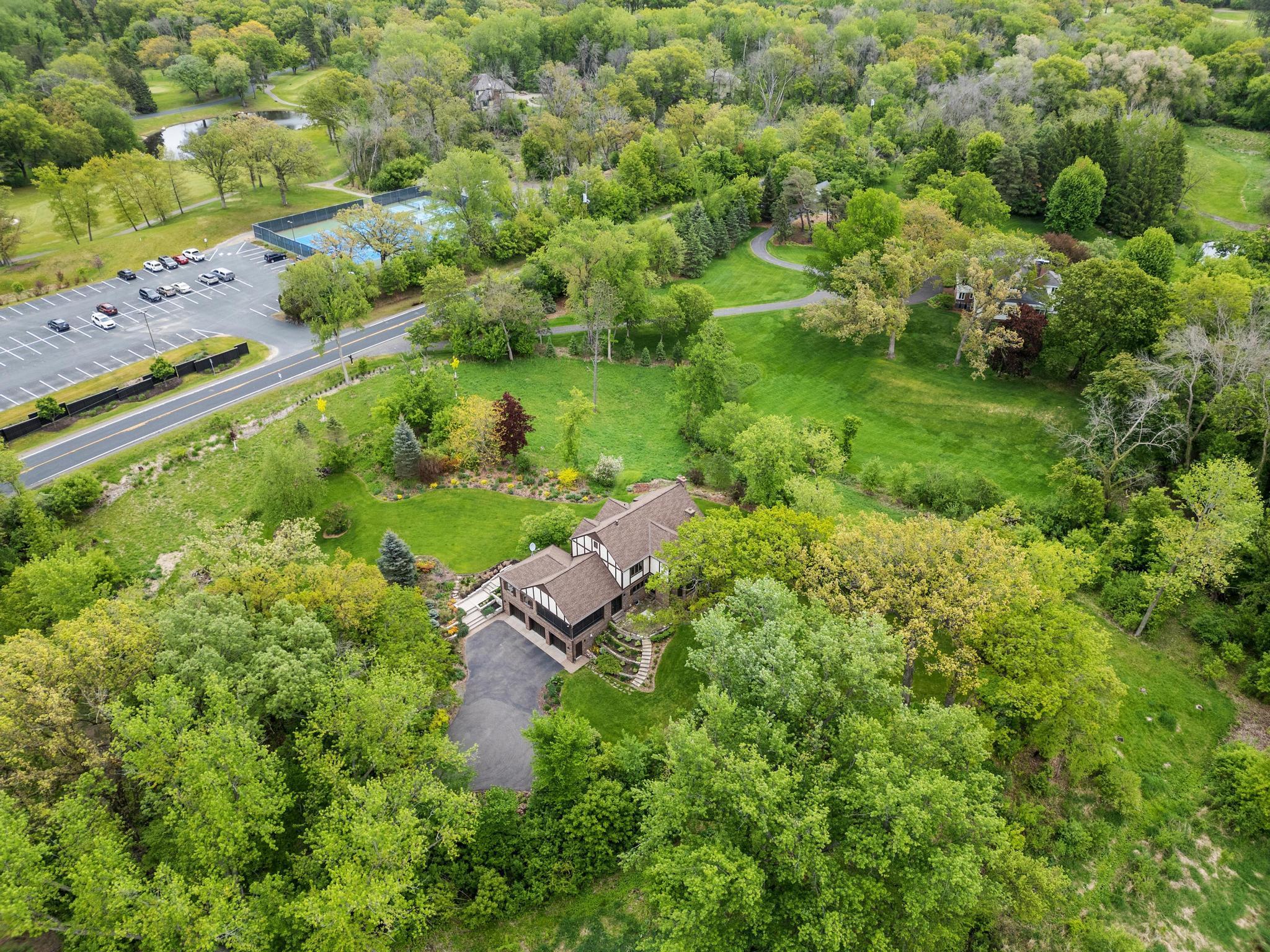Incredible privacy and tranquility just steps from Dellwood Country Club.