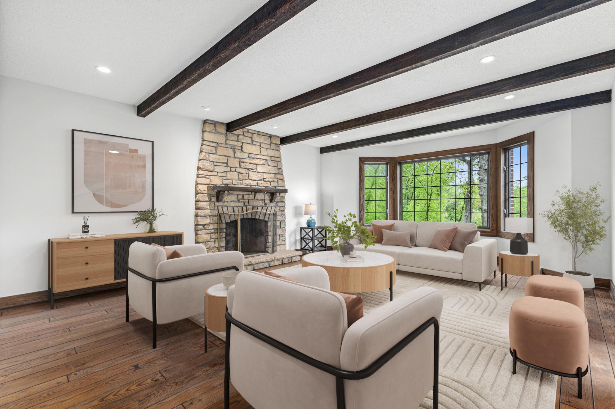 Inviting family room with panoramic views, hardwood floors, access to the patio and wood burning fireplace. Watch your favorite movie, or the big game in this warm/inviting space. Visually staged.