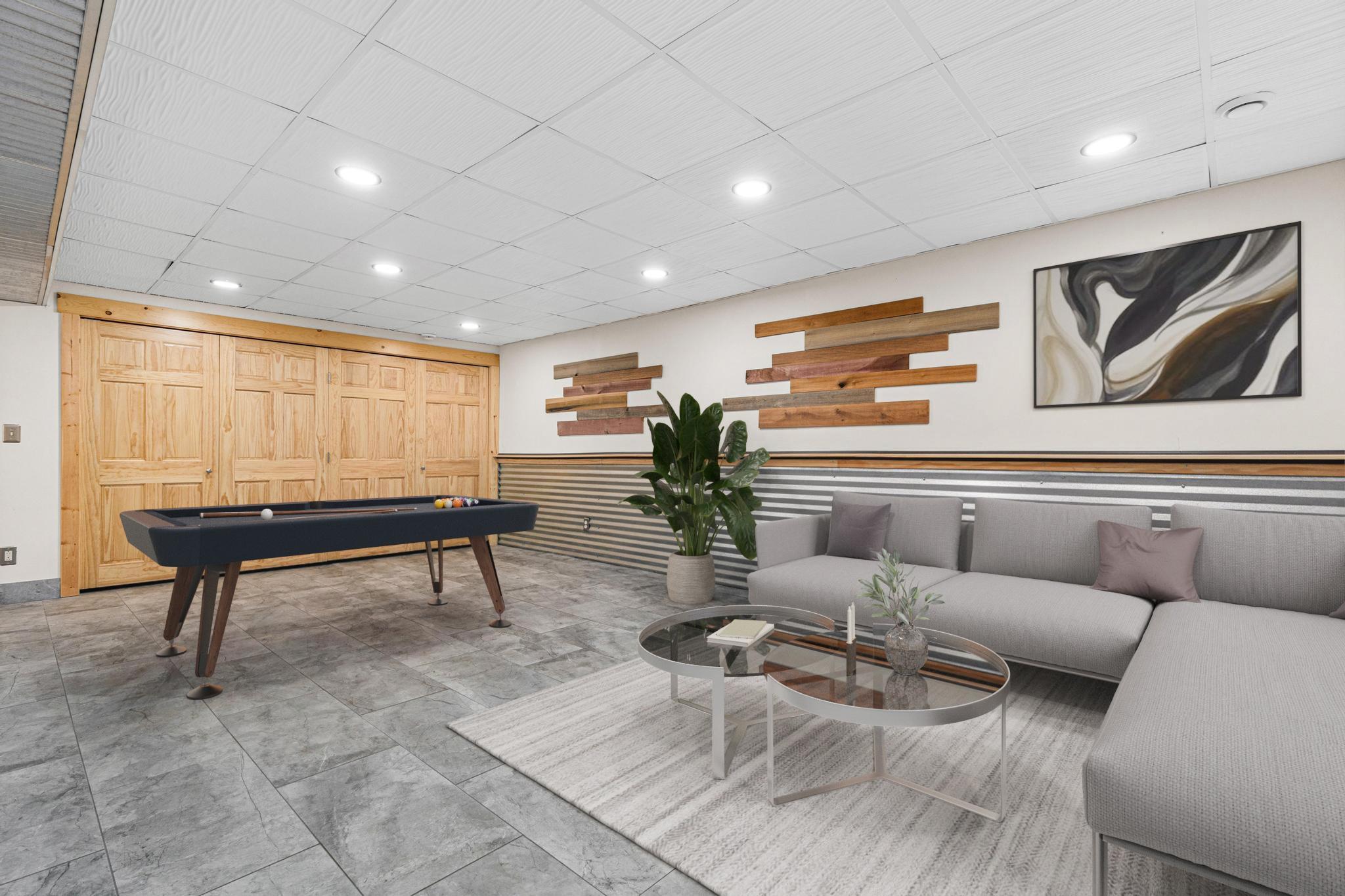 Expansive lower level perfect for hobbies, recreation, fitness, or storage. Visually staged.