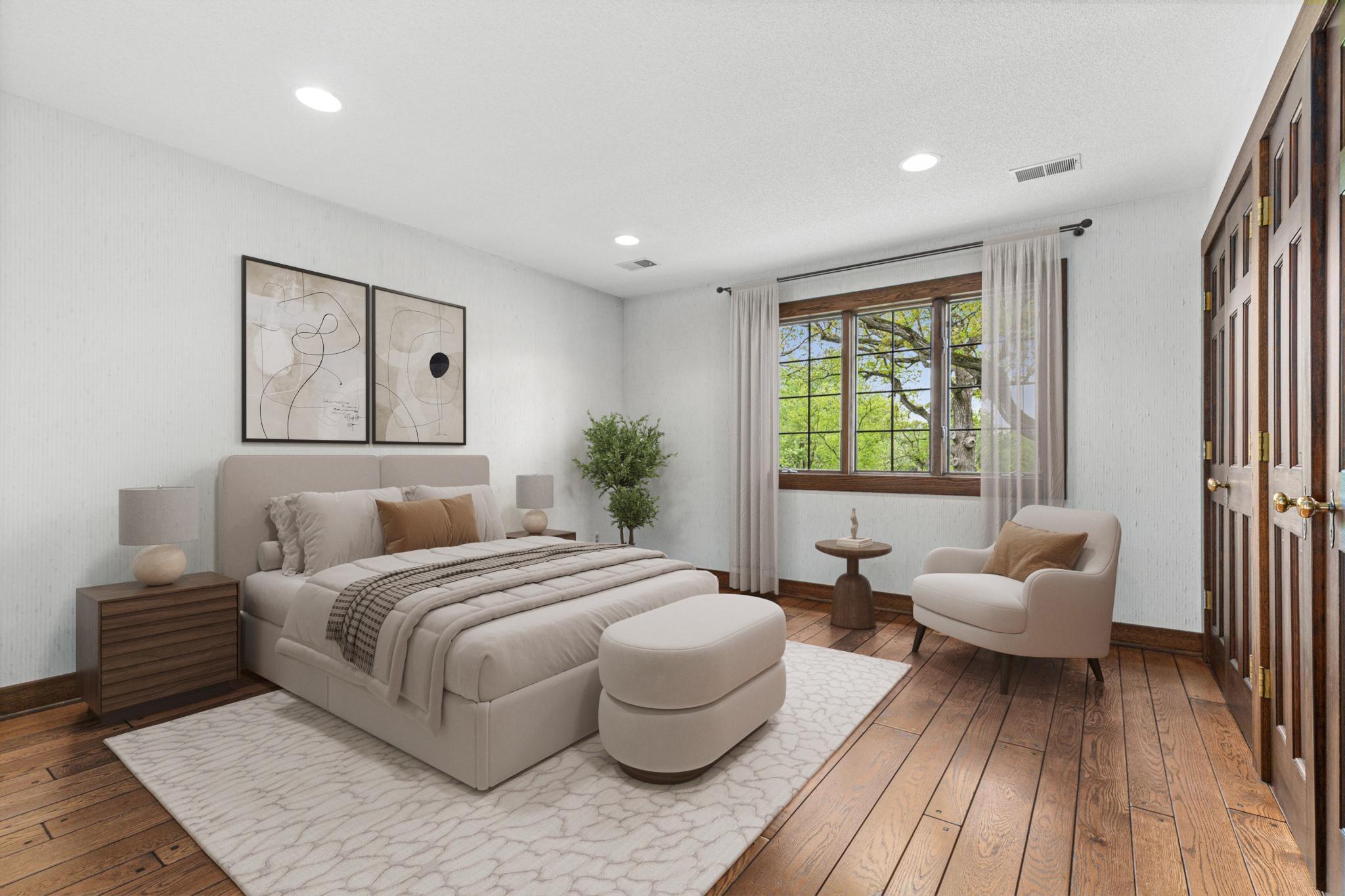 One of four spacious upper-level bedrooms with beautiful views. Visually staged.