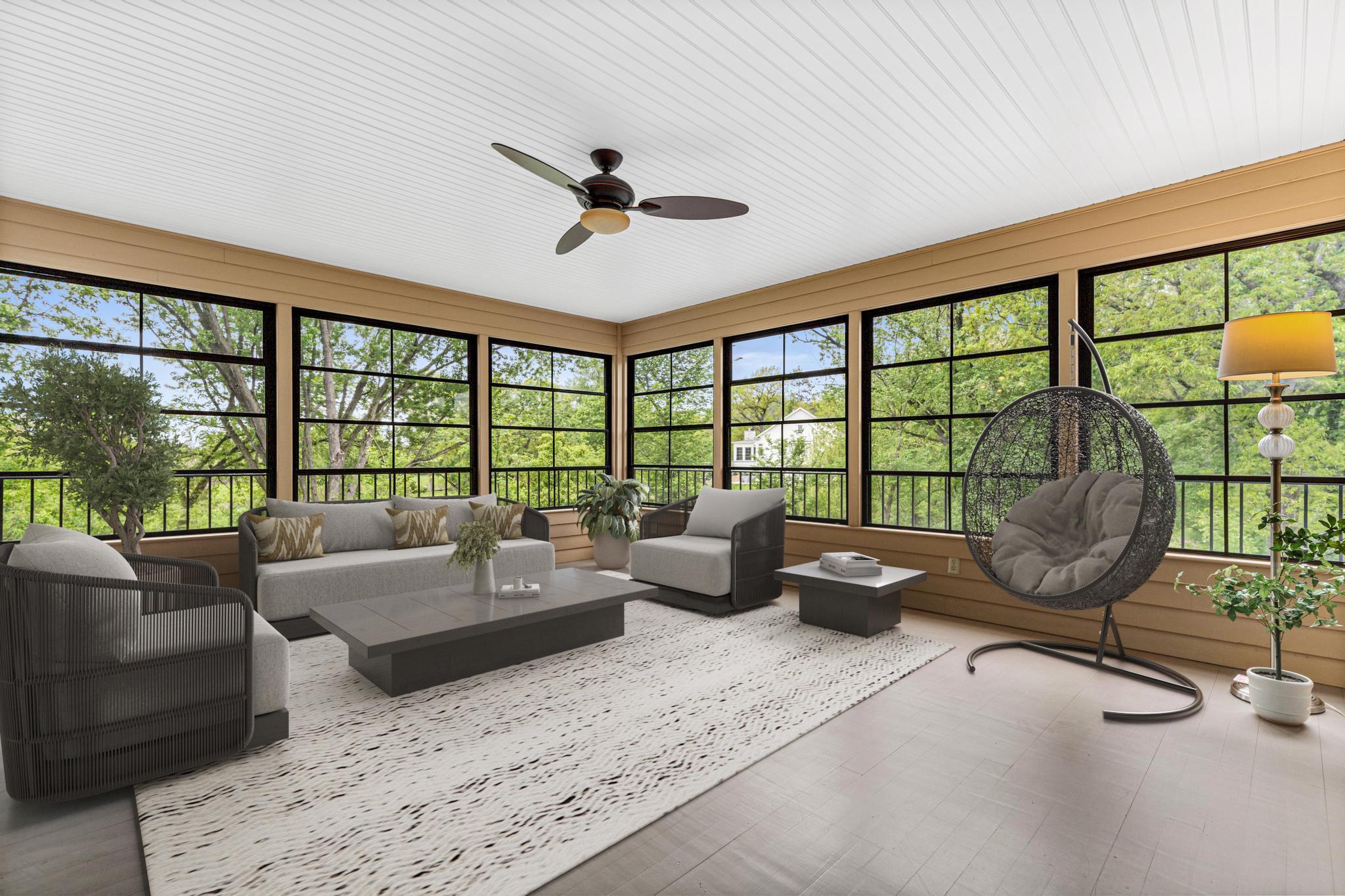 Peaceful screened porch overlooking private, park-like grounds. Visually staged.