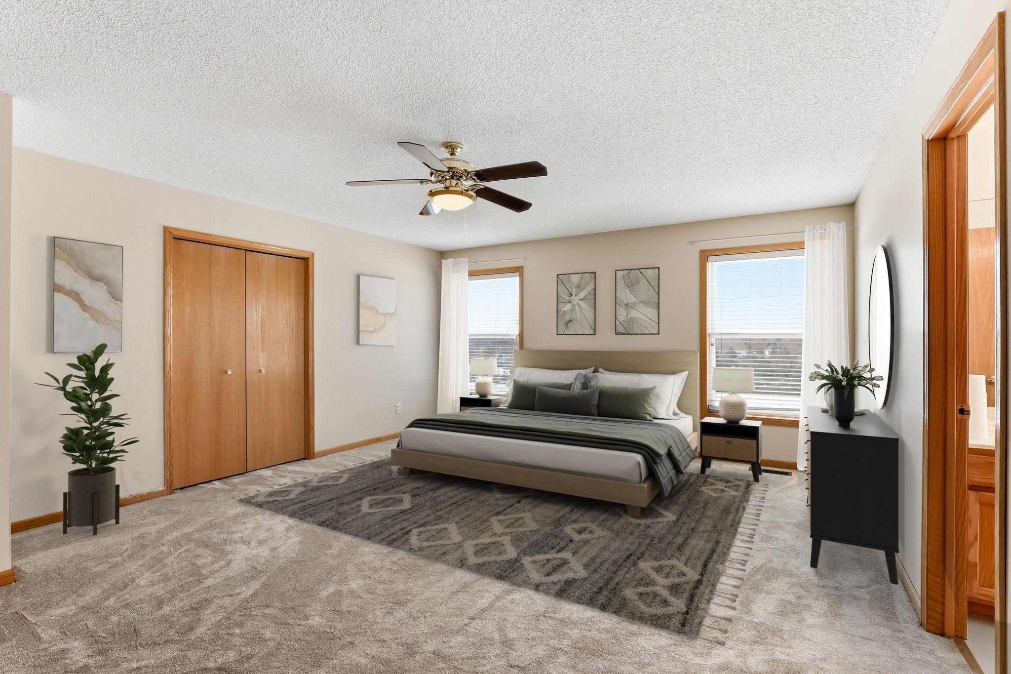 Vitually staged primary bedroom, so much room!