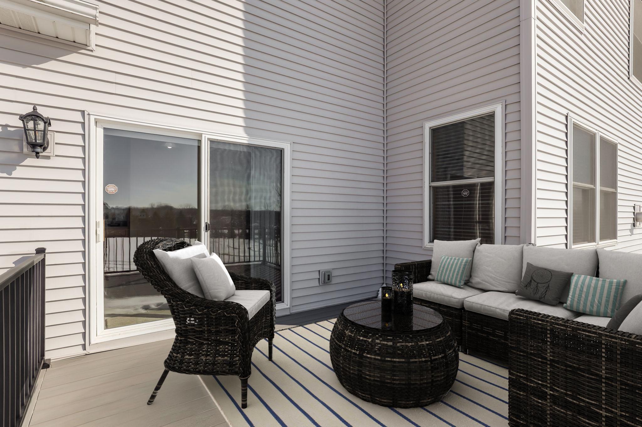 Newly surfaced maintenance-free composite deck with aluminum railing - virtually staged
