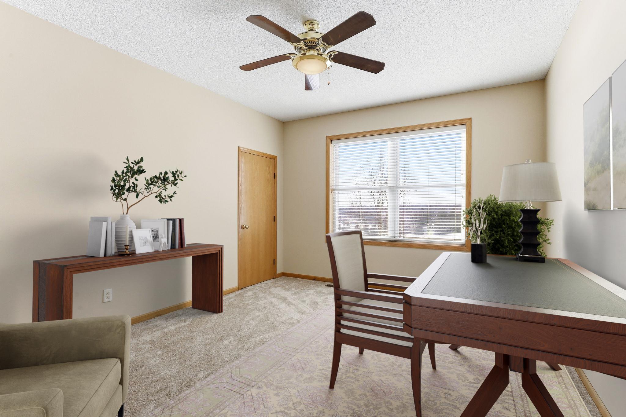 Main level bedroom with spacious walk-in closet; 6 of the 7 bedrooms have large walk-in closets! Virtually staged as an office.